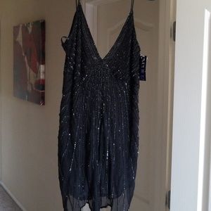 Black sequined and beaded spaghetti strap blouse.